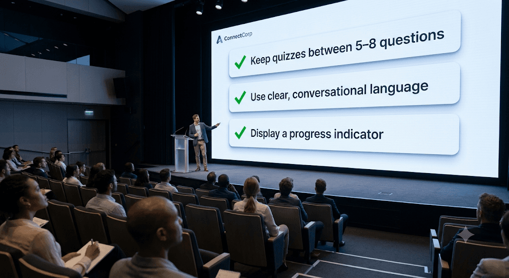 A presenter on stage in front of an audience, pointing at a checklist slide during a conference talk.